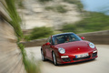 Porsche 997 Targa 4S MkII rouge 3/4 avant droit travelling penché