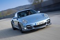 Porsche 997 Turbo S bleu 3/4 avant droit travelling penché