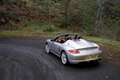 Porsche Boxster Spyder gris 3/4 arrière gauche travelling