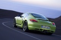 Porsche Cayman R vert 3/4 arrière gauche travelling penché