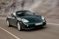 Porsche Cayman S vert 3/4 avant droit travelling penché 2