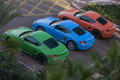 Porsche Cayman S vert & bleu & rouge 3/4 arrière gauche vue de haut