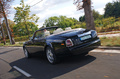 Rolls Royce Phantom Drophead Coupe noir 3/4 arrière gauche travelling penché