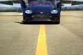 Spyker C8 Spyder noir face avant portes ouvertes debout