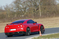 Nissan GTR rouge 3/4 arrière droit penché