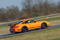 Porsche 997 GT3 RS orange 3/4 arrière droit filé penché