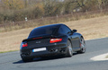Porsche 997 Turbo noir 3/4 arrière droit penché