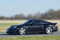 Porsche 997 Turbo noir 3/4 avant gauche filé