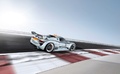 Porsche 918 RSR gris/orange 3/4 arrière droit travelling penché