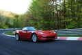 Chevrolet Corvette C6 ZR1 rouge 3/4 avant droit travelling penché 3