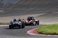 Autodrome Radical Meeting - Caterham Super 7 V8 anthracite face avant & KTM X-Bow R blanc/orange 3/4 avant gauche