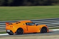 Lotus Exige S orange 3/4 arrière droit filé