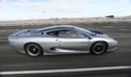 Jaguar XJ220 gris profil travelling