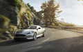 Aston Martin DB9 MY2013 gris 3/4 avant gauche travelling