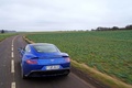 Aston Martin Vanquish bleu face arrière travelling 2