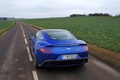 Aston Martin Vanquish bleu face arrière travelling