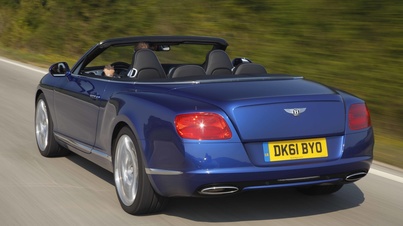 Bentley Continental GTC 2011 bleu vue de 3/4 arrière gauche en travelling
