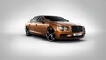 Bentley Flying Spur W12 S orange 3/4 avant droit