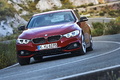 BMW Série 4 435i - rouge - 3/4 avant gauche dynamique penché