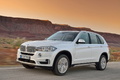 BMW X5 2013 - blanc - 3/4 avant gauche dynamique