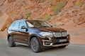 BMW X5 2013 - marron - 3/4 avant droit dynamique