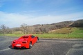 Ferrari 458 Spider rouge 3/4 arrière droit fermé vue de haut penché