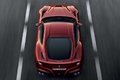 Ferrari F12 Berlinetta rouge face arrière travelling vue de haut