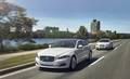 Jaguar XJ AWD blanc & XF AWD blanc 3/4 avant gauche travelling