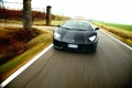 Lamborghini Aventador noir face avant travelling penché 2