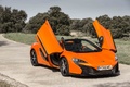 McLaren 650S Spider orange 3/4 avant droit portes ouvertes