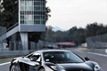 McLaren MP4-12C noir 3/4 avant droit debout