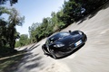 McLaren MP4-12C noir 3/4 avant droit travelling penché