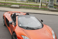 McLaren MP4-12C Spider orange 3/4 avant droit debout