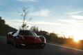 Pagani Huayra bordeaux 3/4 avant droit travelling