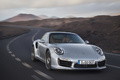 Porsche 991 Turbo S gris 3/4 avant droit travelling