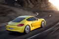 Porsche Cayman S jaune 3/4 arrière droit travelling
