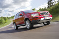 Volvo XC90 V8 rouge 3/4 avant droit travelling penché