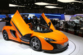 McLaren 650S Spider orange 3/4 avant droit portes ouvertes