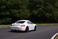 Porsche Cayman Cup blanc 3/4 arrière droit travelling