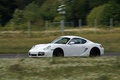 Porsche Cayman Cup blanc 3/4 avant gauche filé